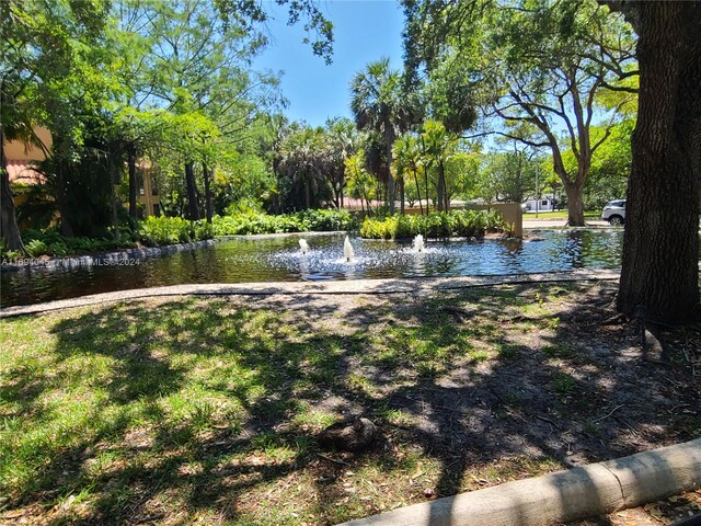 surrounding community with a water view