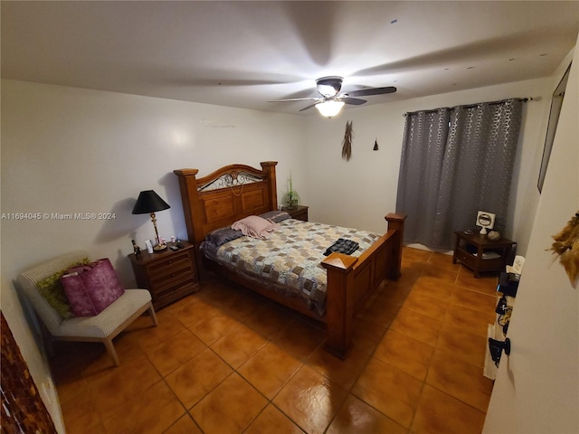 tiled bedroom with ceiling fan