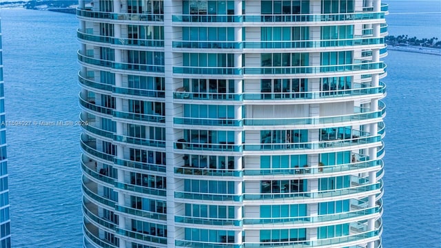 view of building exterior with a water view