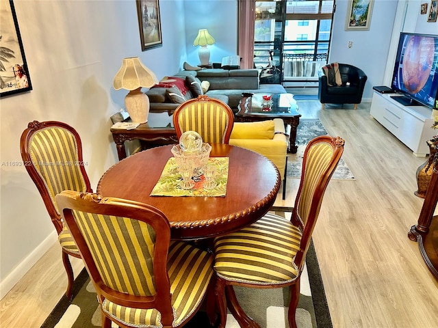 dining space featuring light hardwood / wood-style flooring