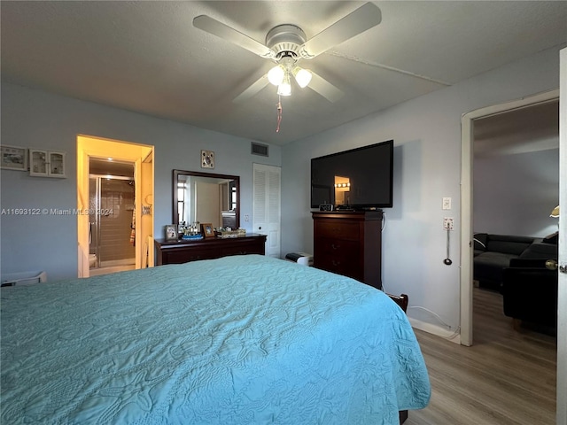 bedroom with hardwood / wood-style floors and ceiling fan