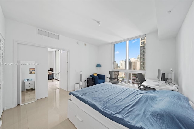 bedroom with floor to ceiling windows