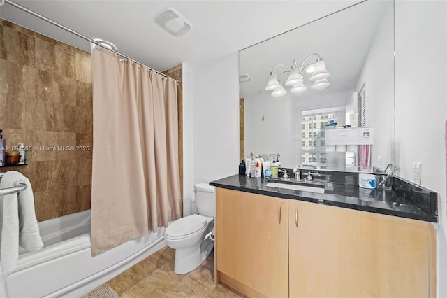 full bathroom featuring toilet, shower / tub combo, and vanity