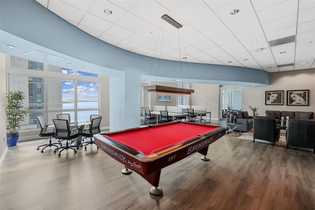 recreation room with a water view, a paneled ceiling, pool table, and hardwood / wood-style flooring