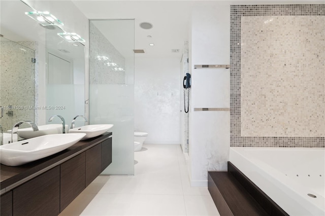 full bathroom with tile patterned flooring, vanity, toilet, and tile walls