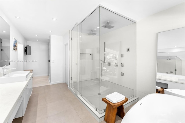 bathroom featuring tile patterned floors, vanity, and separate shower and tub