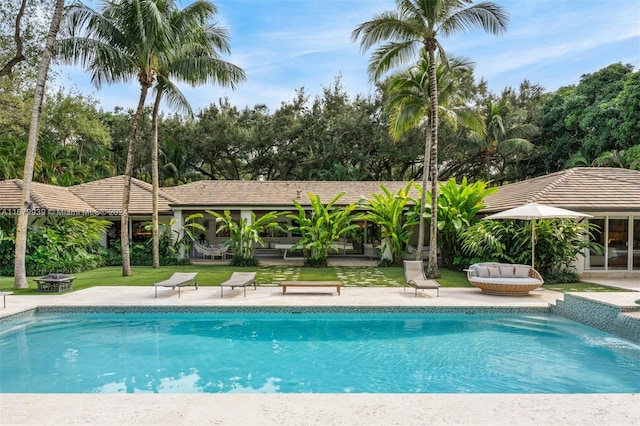 view of pool with an outdoor fire pit