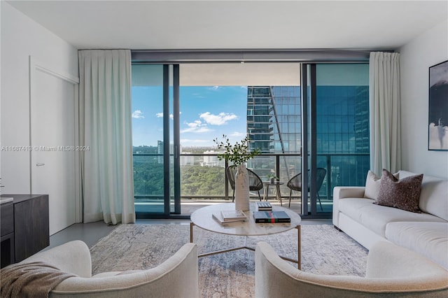 living room featuring floor to ceiling windows