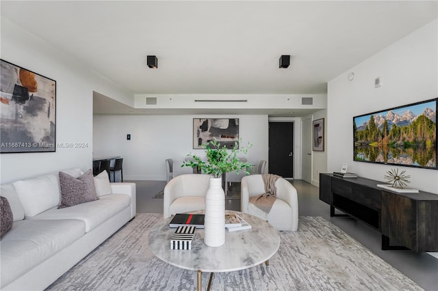 living room featuring concrete floors