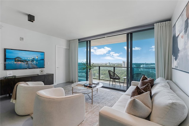 living room featuring floor to ceiling windows and a wealth of natural light