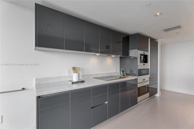 kitchen with black electric cooktop