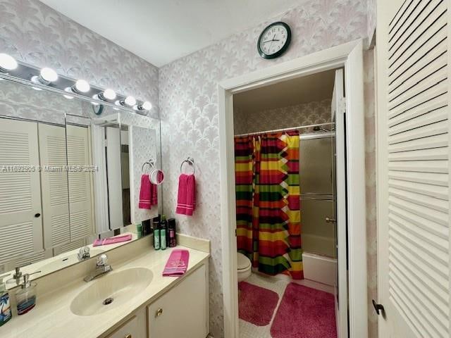 full bathroom featuring vanity, toilet, and shower / bathtub combination with curtain