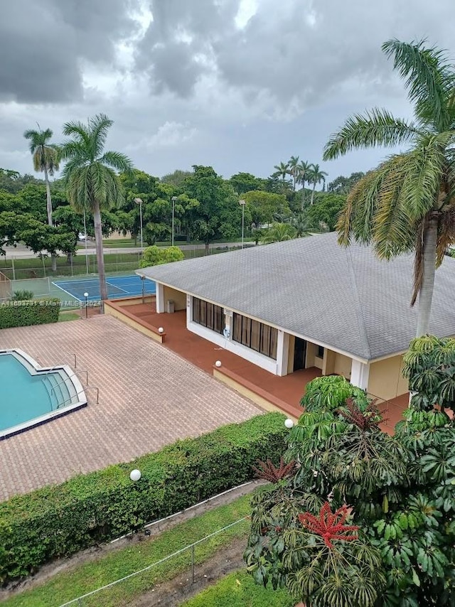 exterior space with tennis court