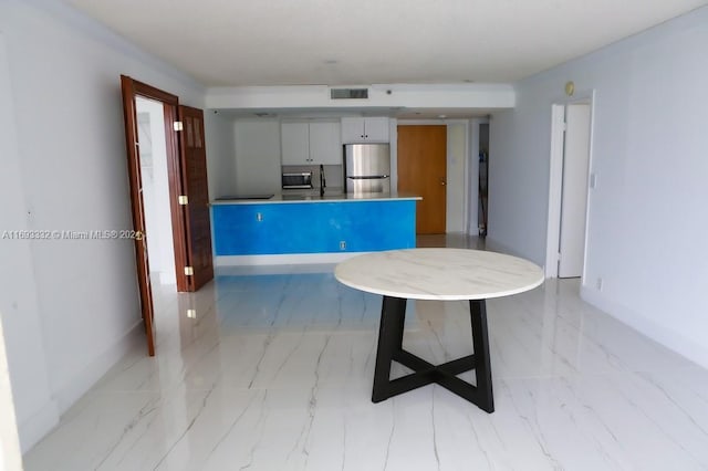 kitchen featuring kitchen peninsula and stainless steel appliances