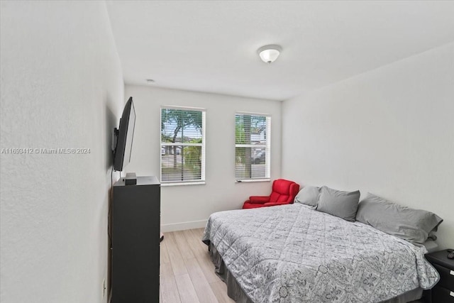 bedroom with light wood-type flooring