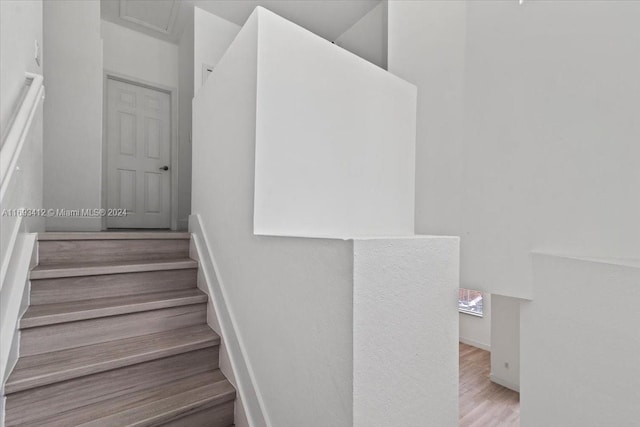 staircase featuring hardwood / wood-style floors