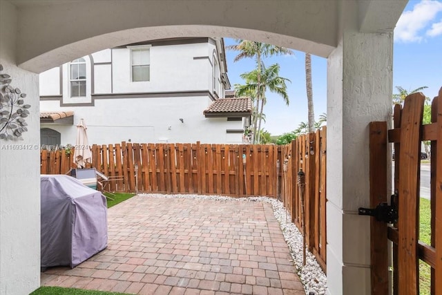 view of patio featuring a grill