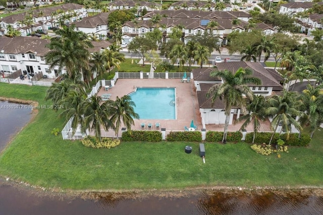 birds eye view of property with a water view