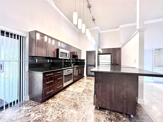 kitchen with a center island, decorative backsplash, decorative light fixtures, dark brown cabinetry, and stainless steel appliances