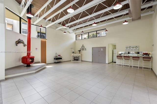 garage with white refrigerator and wood ceiling