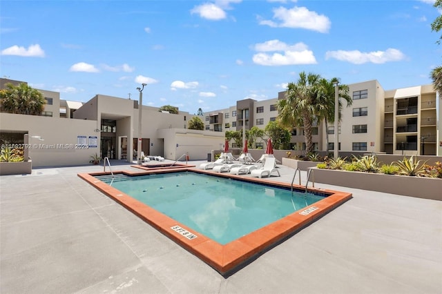 view of swimming pool featuring a patio