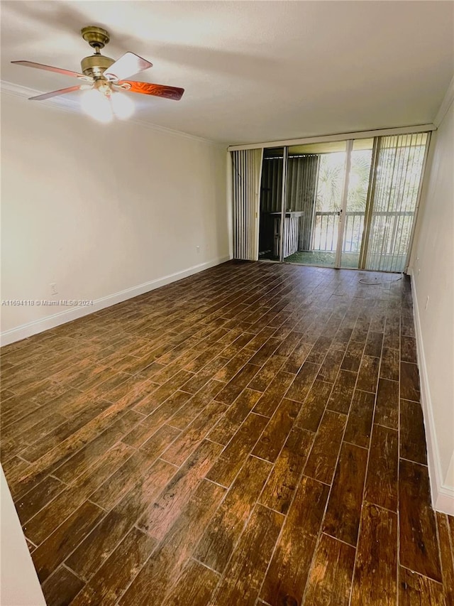 unfurnished living room featuring dark hardwood / wood-style floors, ceiling fan, and ornamental molding