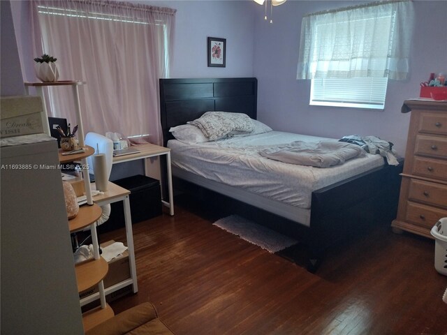 bedroom featuring dark hardwood / wood-style flooring