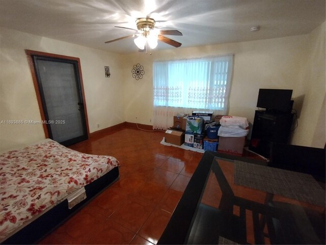 tiled bedroom with ceiling fan