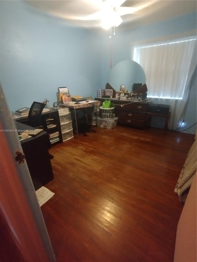 office area featuring ceiling fan and dark wood-type flooring