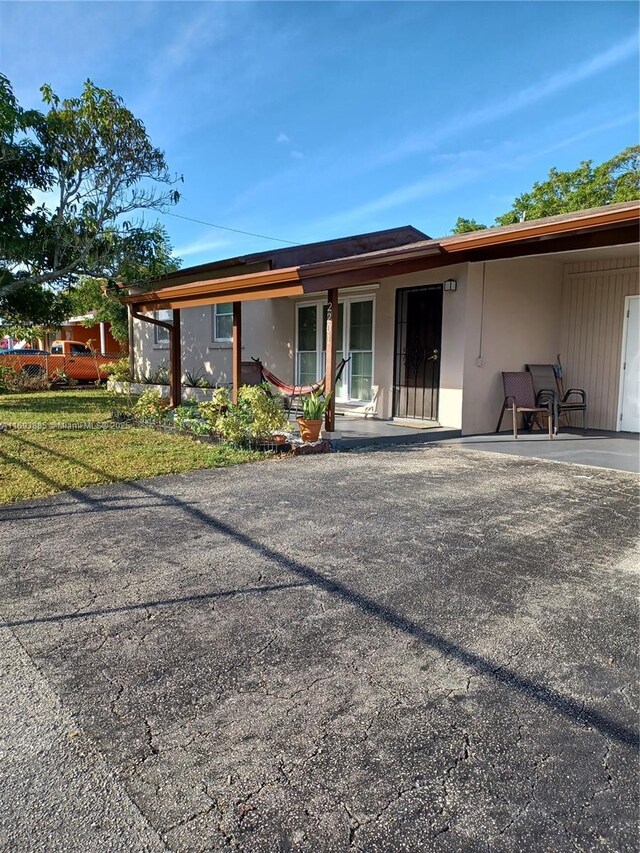 back of house with a patio