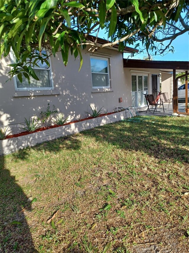 exterior space featuring a yard and a patio