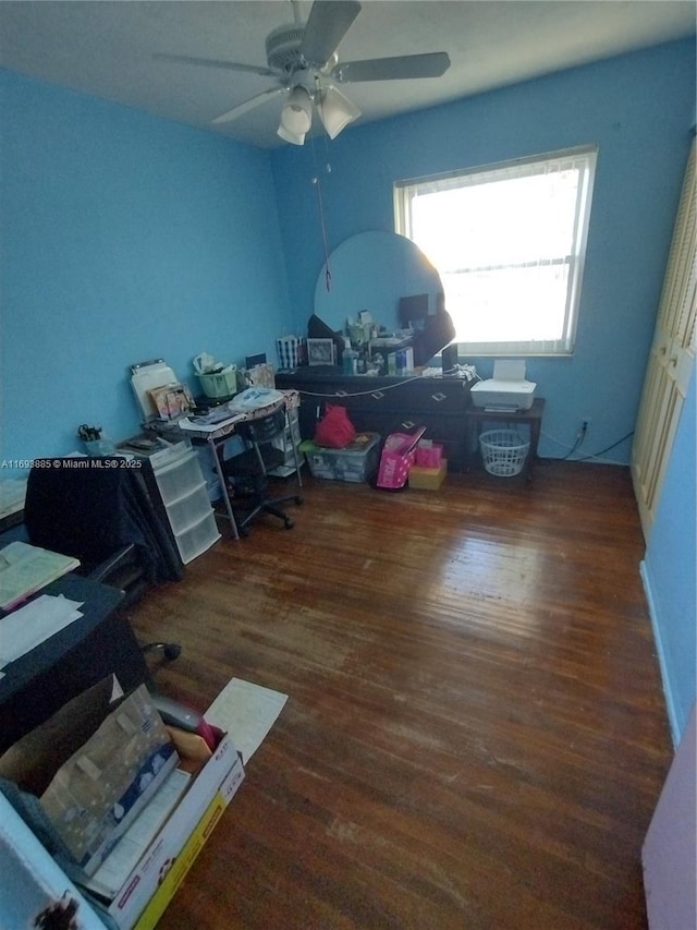 office with ceiling fan and dark wood-type flooring