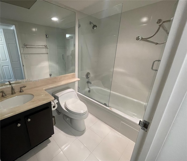 bathroom with toilet, tile patterned floors, vanity, and enclosed tub / shower combo