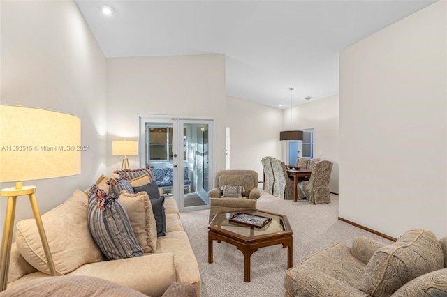 carpeted living room featuring french doors