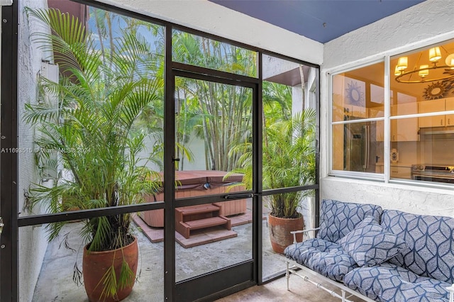 doorway to outside with an inviting chandelier