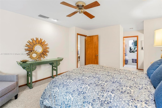 carpeted bedroom with connected bathroom and ceiling fan