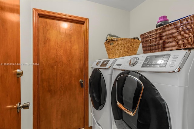 washroom with washing machine and dryer