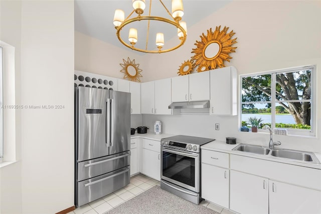 kitchen featuring pendant lighting, white cabinets, sink, light tile patterned floors, and stainless steel appliances