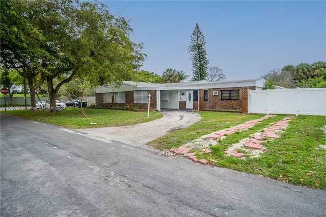 ranch-style house with a front yard