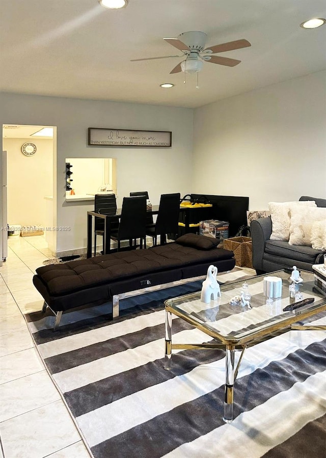 living room with tile patterned flooring and ceiling fan