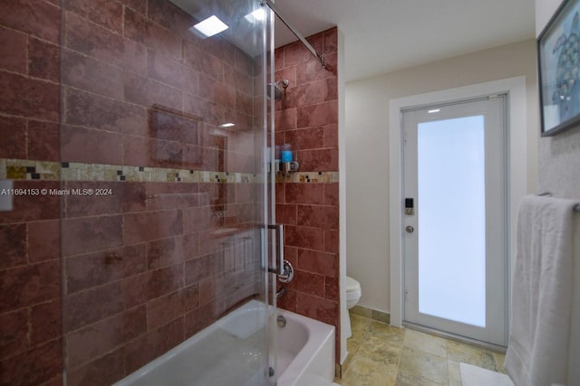 full bathroom with toilet and washtub / shower combination