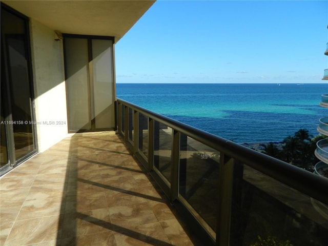 balcony featuring a water view