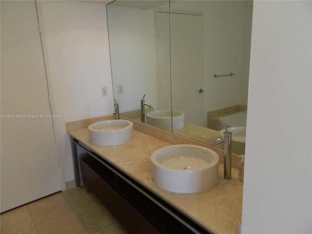 bathroom featuring tile patterned flooring and vanity