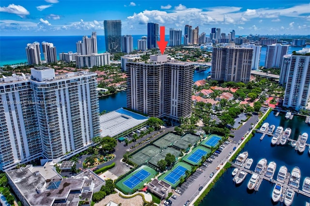 birds eye view of property with a water view