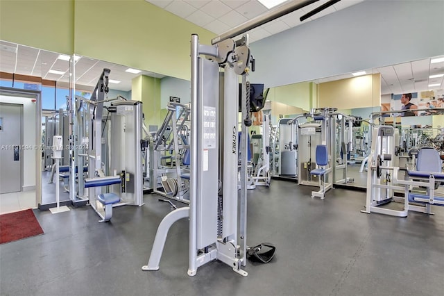 exercise room with a drop ceiling