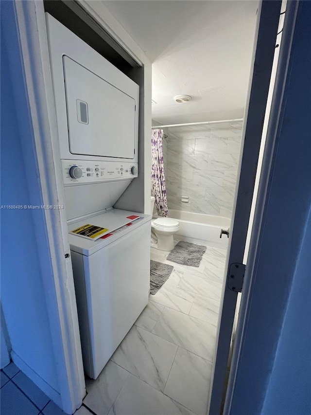 laundry room featuring stacked washing maching and dryer