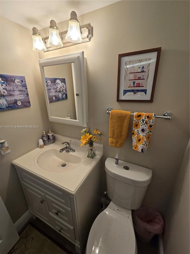 bathroom with vanity and toilet