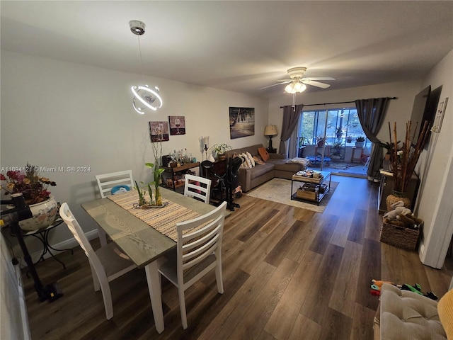 dining area featuring ceiling fan and dark hardwood / wood-style floors