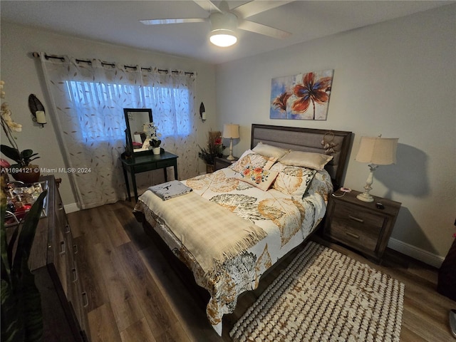 bedroom featuring dark hardwood / wood-style floors and ceiling fan