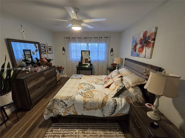 bedroom with hardwood / wood-style flooring and ceiling fan